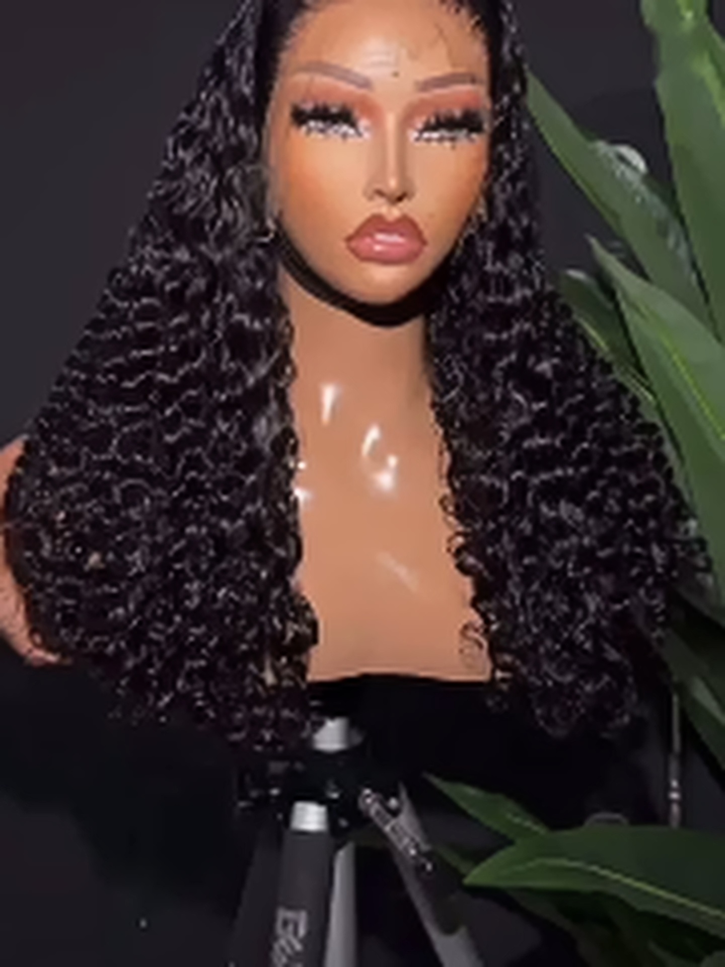 Curly wig unit displayed by Enjay Beauty Hub